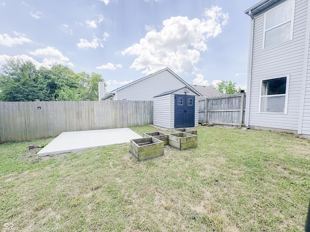 1381 Harrison Dr, Greenwood, IN 46143 - fenced backyard featuring a shed, a patio area, and a vegetable garden
