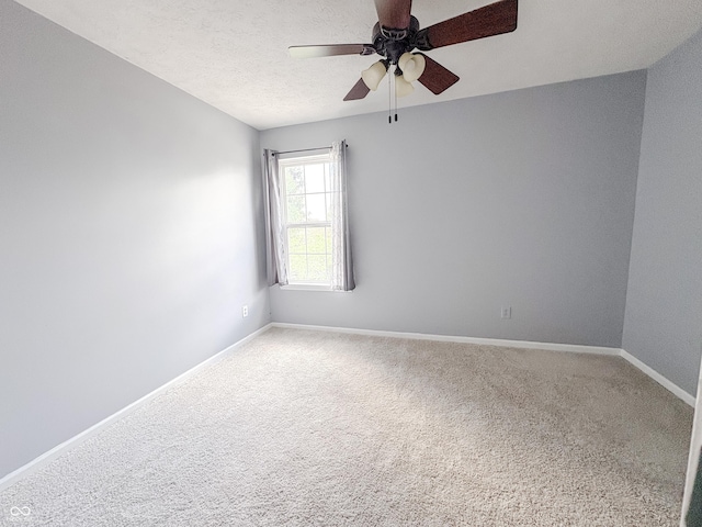 1381 Harrison Dr, Greenwood, IN 46143 - carpeted empty room with a ceiling fan and baseboards
