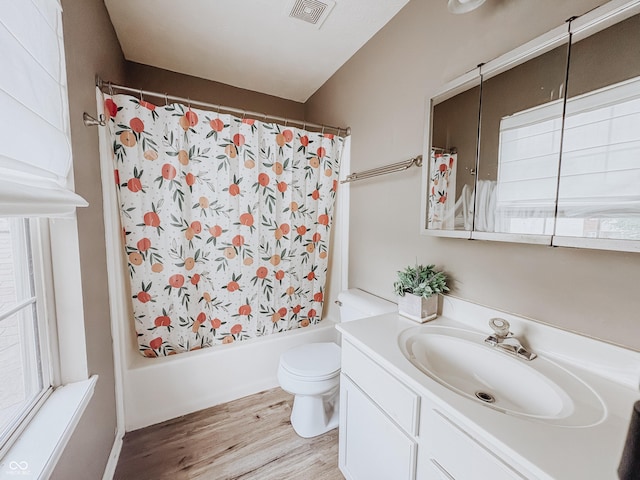 1381 Harrison Dr, Greenwood, IN 46143 - full bath featuring vanity, wood finished floors, shower / bath combo with shower curtain, and healthy amount of natural light
