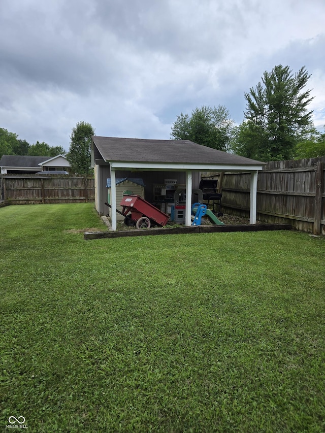 310 Tiffany Ln, North Vernon, IN 47265 - fenced backyard featuring an outdoor structure