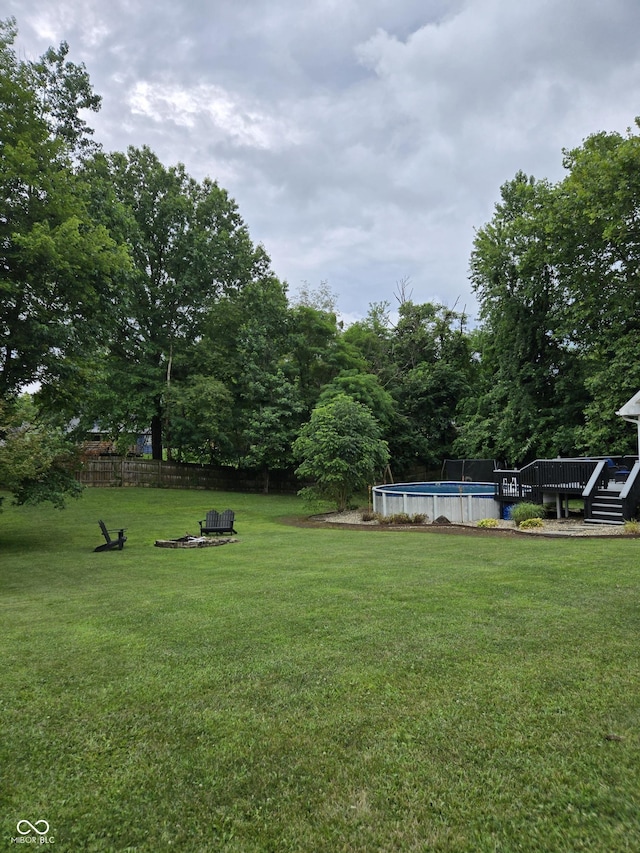 310 Tiffany Ln, North Vernon, IN 47265 - view of yard with an outdoor pool and a deck