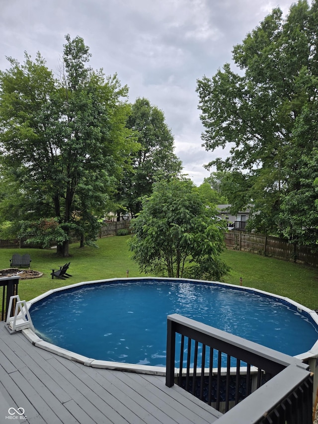 310 Tiffany Ln, North Vernon, IN 47265 - swimming pool with a fenced backyard and a wooden deck