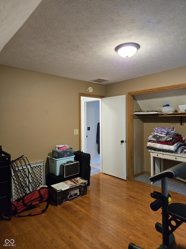 310 Tiffany Ln, North Vernon, IN 47265 - office space with wood finished floors and a textured ceiling