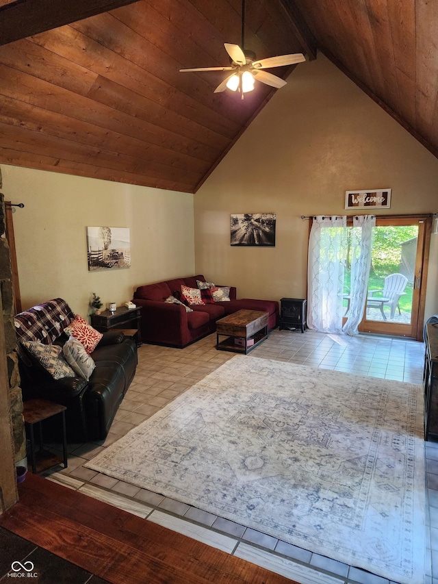 6774 S Becks Grove Rd, Freetown, IN 47235 - living area featuring tile patterned floors, ceiling fan, a wood ceiling with exposed beams, high vaulted ceiling, and a wood stove