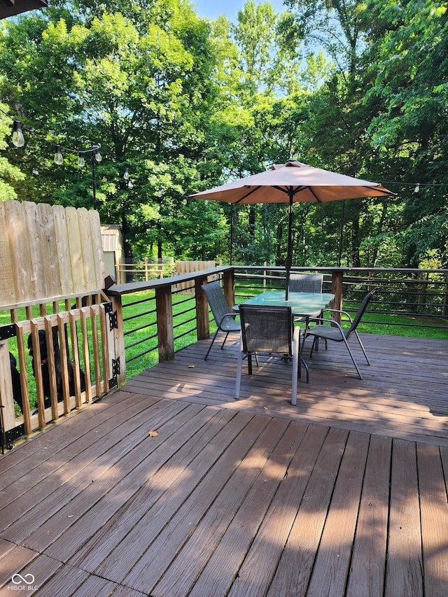 6774 S Becks Grove Rd, Freetown, IN 47235 - deck featuring outdoor dining space and view of scattered trees
