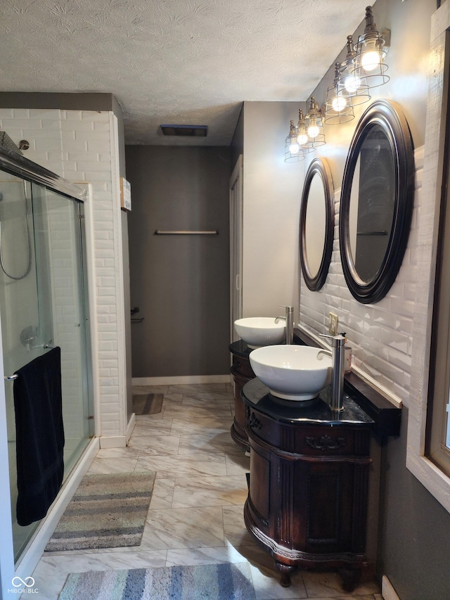 6774 S Becks Grove Rd, Freetown, IN 47235 - full bath featuring a shower stall, double vanity, a textured ceiling, and marble look tile flooring