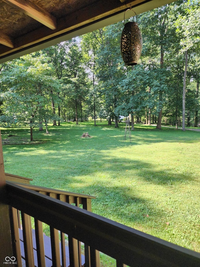 6774 S Becks Grove Rd, Freetown, IN 47235 - view of green lawn with view of scattered trees and a balcony