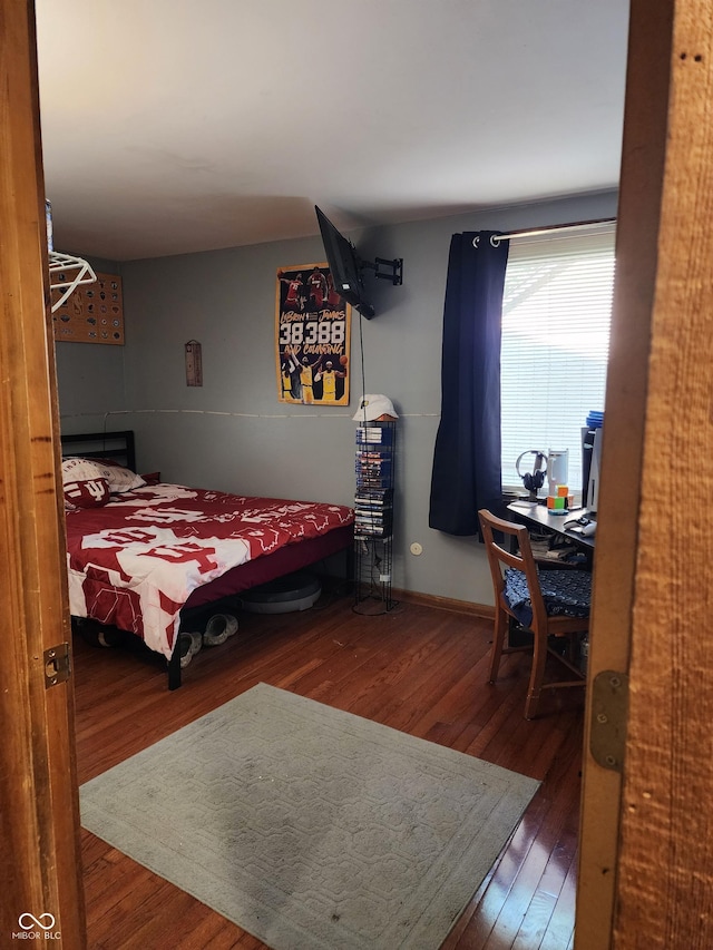 6774 S Becks Grove Rd, Freetown, IN 47235 - bedroom featuring hardwood / wood-style flooring and baseboards