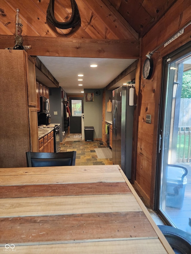 6774 S Becks Grove Rd, Freetown, IN 47235 - kitchen with appliances with stainless steel finishes, beam ceiling, brown cabinets, and recessed lighting