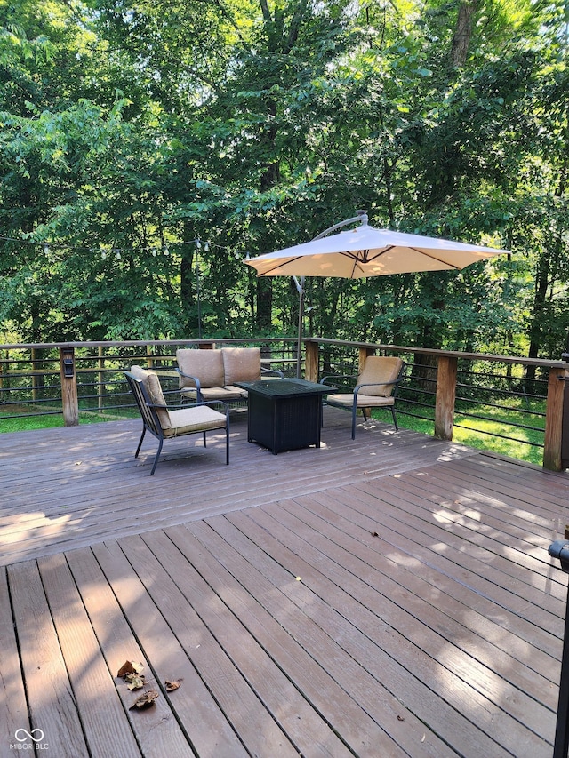 6774 S Becks Grove Rd, Freetown, IN 47235 - wooden deck featuring an outdoor living space