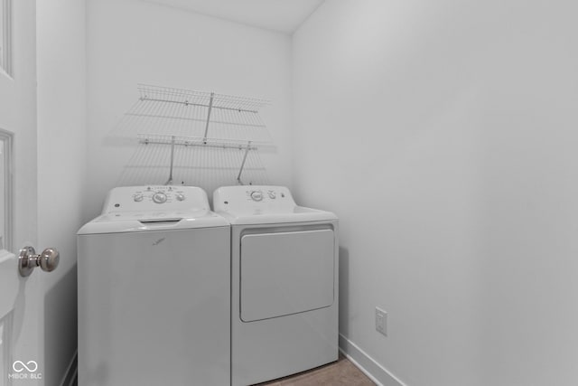 7265 Governors Row, Avon, IN 46123 - washroom featuring washing machine and dryer and baseboards