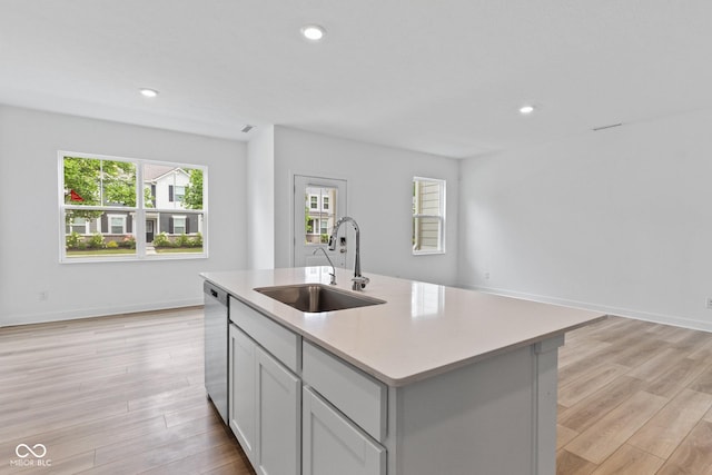 7265 Governors Row, Avon, IN 46123 - kitchen featuring light countertops, a center island with sink, recessed lighting, light wood-style flooring, and stainless steel dishwasher