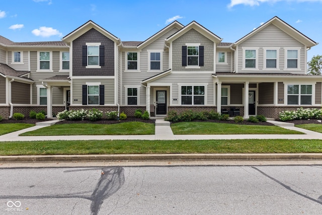 7265 Governors Row, Avon, IN 46123 - multi unit property featuring brick siding and a front yard