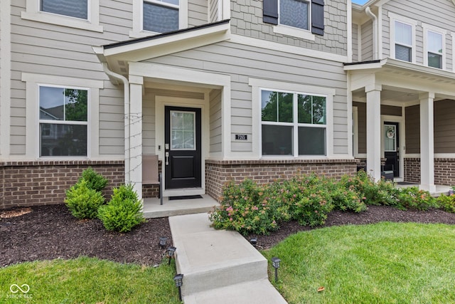 7265 Governors Row, Avon, IN 46123 - property entrance with brick siding and a yard