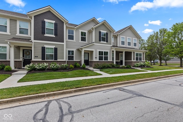 7265 Governors Row, Avon, IN 46123 - multi unit property with brick siding and a front lawn