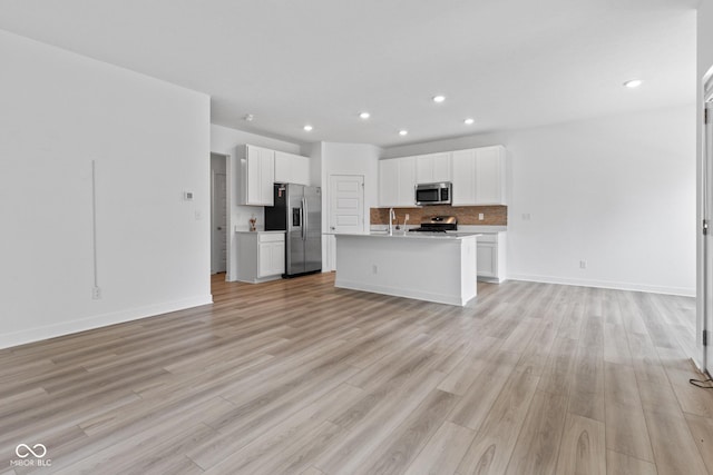 7265 Governors Row, Avon, IN 46123 - kitchen featuring appliances with stainless steel finishes, open floor plan, recessed lighting, white cabinetry, and light countertops