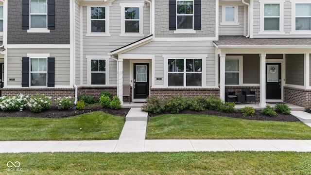 7265 Governors Row, Avon, IN 46123 - multi unit property featuring brick siding and a front lawn