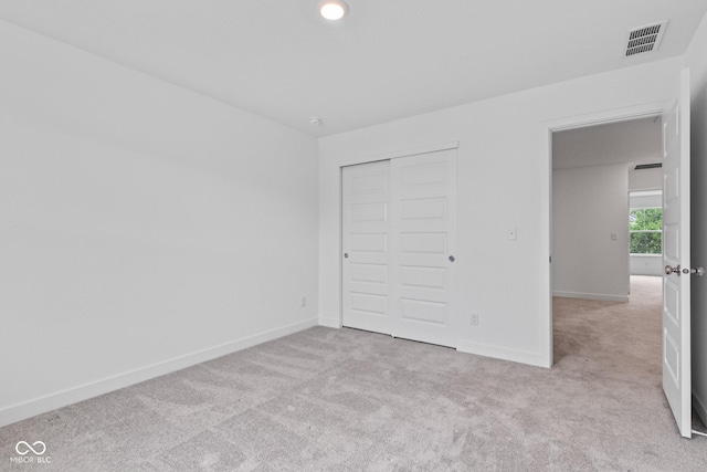 7265 Governors Row, Avon, IN 46123 - unfurnished bedroom featuring light carpet and a closet