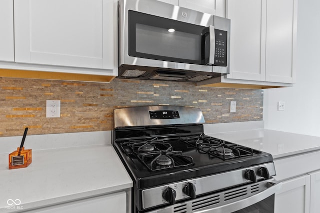 7265 Governors Row, Avon, IN 46123 - kitchen featuring appliances with stainless steel finishes, white cabinets, and light countertops