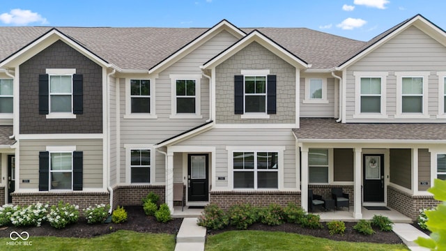 7265 Governors Row, Avon, IN 46123 - view of property with brick siding and roof with shingles
