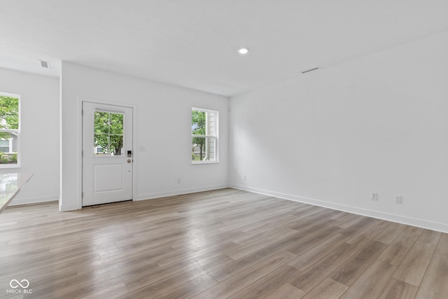 7265 Governors Row, Avon, IN 46123 - unfurnished living room featuring light wood finished floors and baseboards
