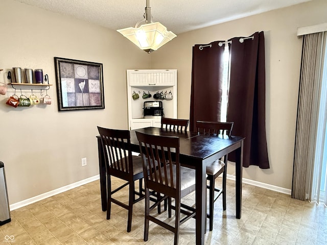6309 Monteo Dr, Indianapolis, IN 46217 - dining area with baseboards and a textured ceiling