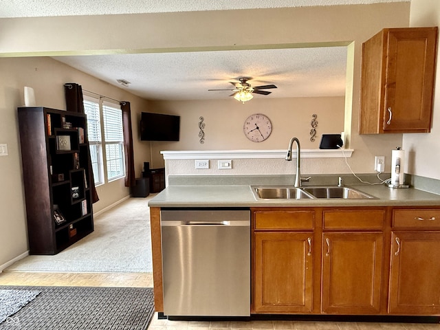6309 Monteo Dr, Indianapolis, IN 46217 - kitchen featuring dishwasher, brown cabinets, a ceiling fan, a textured ceiling, and a peninsula