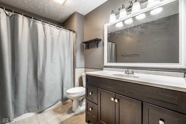 12956 Shandon Ln, Fishers, IN 46038 - full bathroom featuring vanity, tile patterned floors, a wainscoted wall, a textured ceiling, and a shower with curtain