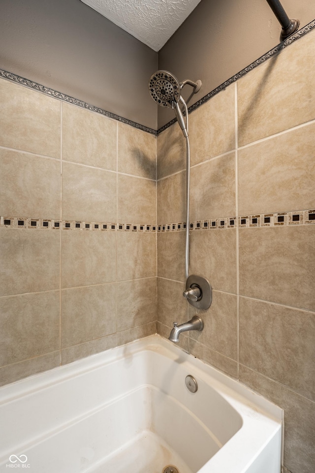 12956 Shandon Ln, Fishers, IN 46038 - bathroom with a textured ceiling and bathing tub / shower combination