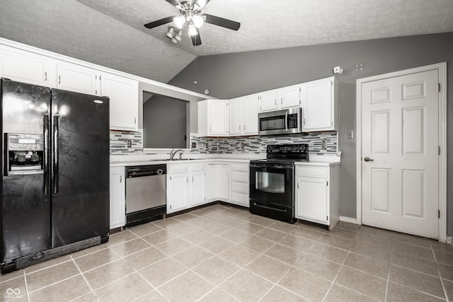 12956 Shandon Ln, Fishers, IN 46038 - kitchen with black appliances, vaulted ceiling, a textured ceiling, light countertops, and decorative backsplash