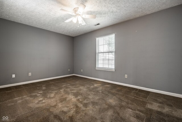 12956 Shandon Ln, Fishers, IN 46038 - empty room featuring a textured ceiling, a ceiling fan, and dark carpet