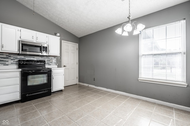 12956 Shandon Ln, Fishers, IN 46038 - kitchen featuring stainless steel microwave, electric range, a textured ceiling, light countertops, and vaulted ceiling
