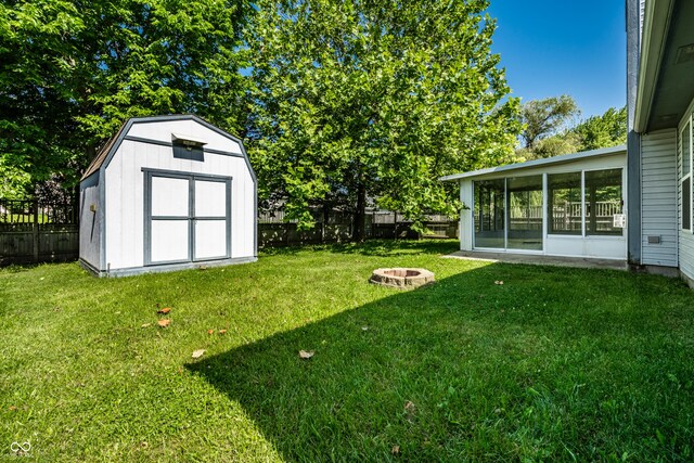 12956 Shandon Ln, Fishers, IN 46038 - fenced backyard with a fire pit, a shed, and a sunroom
