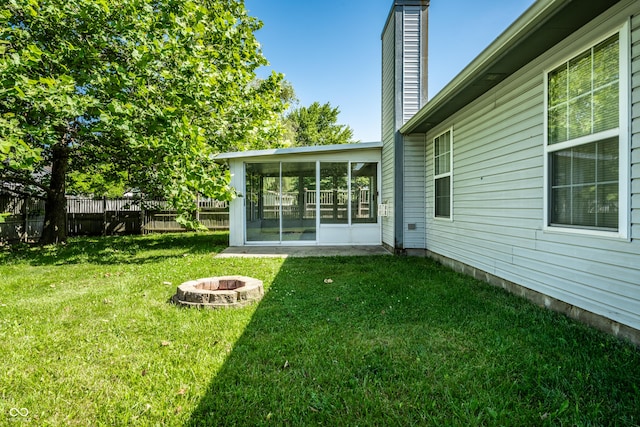 12956 Shandon Ln, Fishers, IN 46038 - view of yard with a sunroom and a fire pit