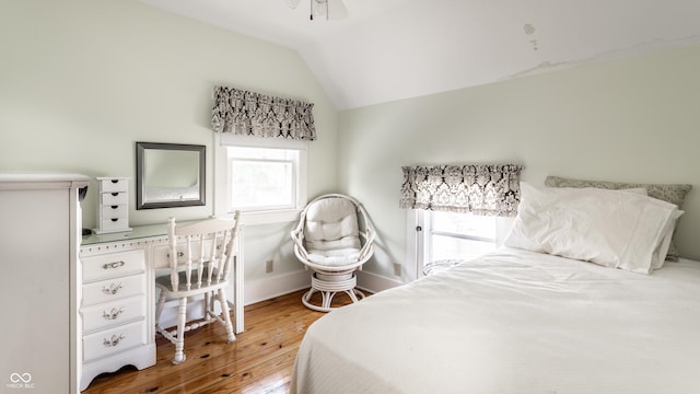 429 W Washington St, Shelbyville, IN 46176 - bedroom featuring hardwood / wood-style flooring, vaulted ceiling, and a desk