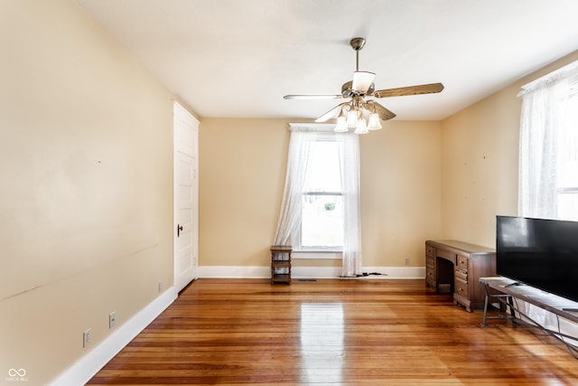 429 W Washington St, Shelbyville, IN 46176 - unfurnished living room with ceiling fan and light wood-style flooring