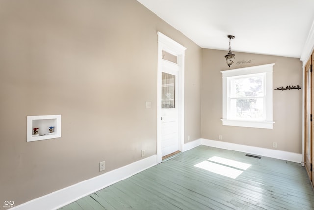 429 W Washington St, Shelbyville, IN 46176 - unfurnished dining area featuring wood finished floors and vaulted ceiling