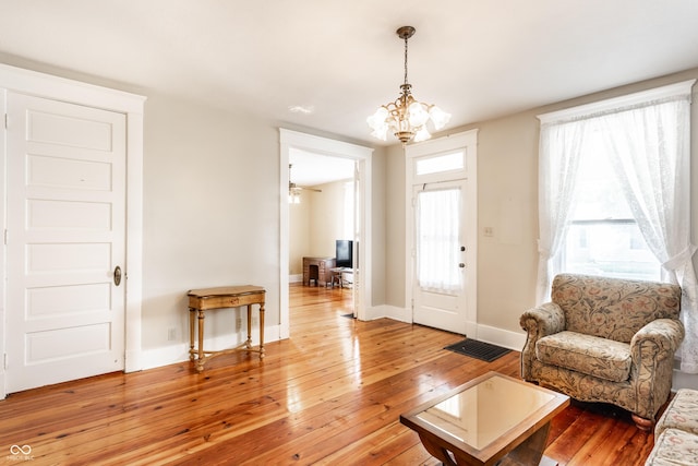 429 W Washington St, Shelbyville, IN 46176 - living area featuring a chandelier and light wood-style floors