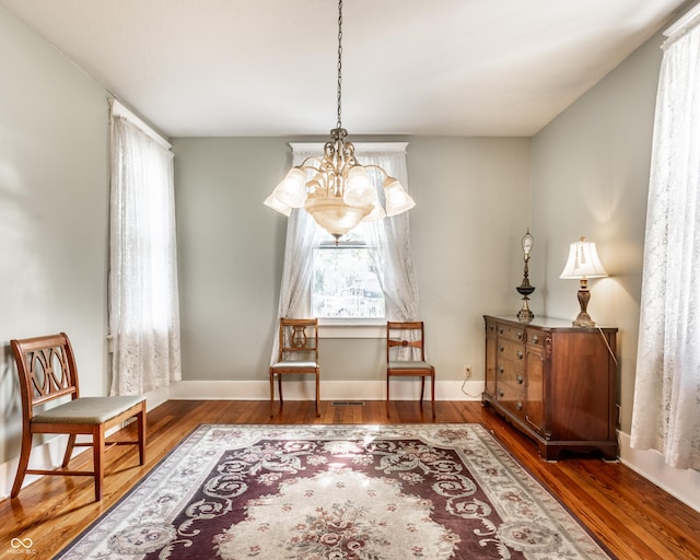 429 W Washington St, Shelbyville, IN 46176 - living area featuring a chandelier and wood finished floors