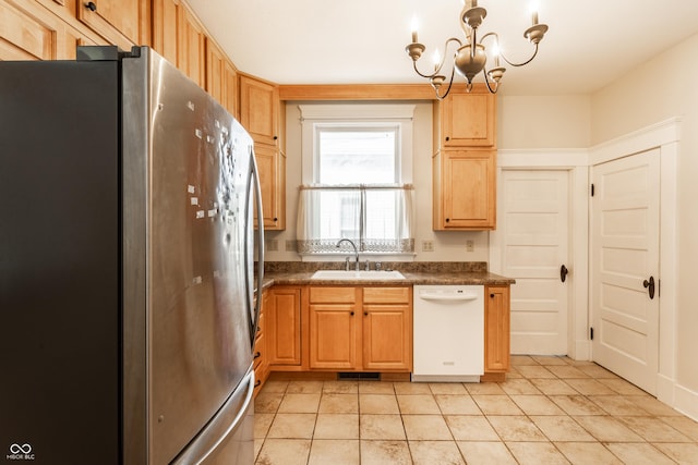 429 W Washington St, Shelbyville, IN 46176 - kitchen with freestanding refrigerator, dishwasher, dark countertops, a chandelier, and light tile patterned floors