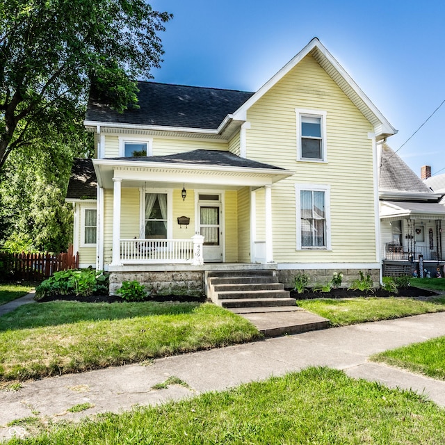 429 W Washington St, Shelbyville, IN 46176 - view of front of home with a porch and roof with shingles