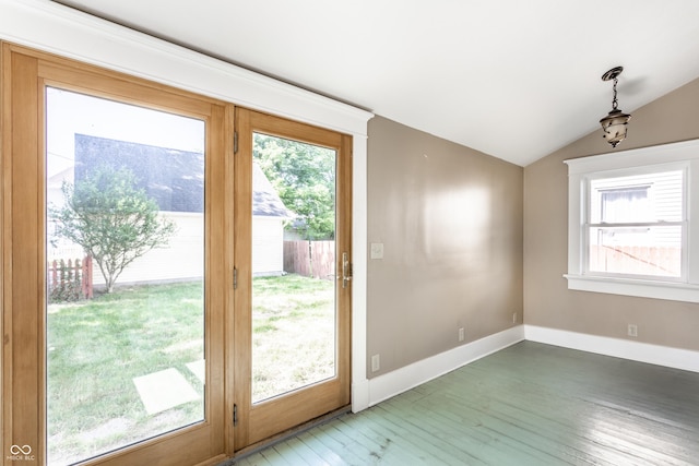 429 W Washington St, Shelbyville, IN 46176 - doorway to outside featuring light wood-type flooring, healthy amount of natural light, and vaulted ceiling