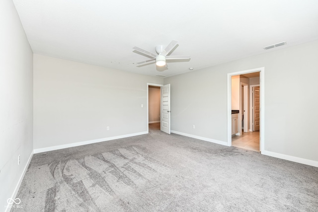 2234 S Bingham Pl, New Palestine, IN 46163 - unfurnished bedroom featuring carpet, connected bathroom, and a ceiling fan