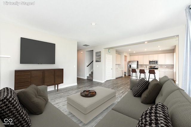 2234 S Bingham Pl, New Palestine, IN 46163 - living area featuring stairs, dark wood-style floors, and recessed lighting