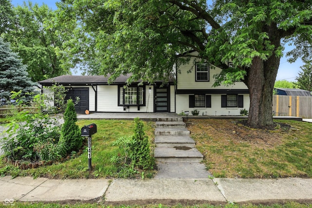 8041 Barry Rd, Indianapolis, IN 46219 - split level home with an attached garage