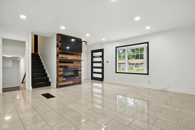 8041 Barry Rd, Indianapolis, IN 46219 - unfurnished living room featuring light tile patterned floors, recessed lighting, stairs, and a fireplace