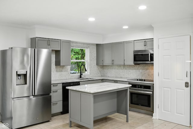 8041 Barry Rd, Indianapolis, IN 46219 - kitchen featuring black appliances, gray cabinets, crown molding, tasteful backsplash, and a kitchen island