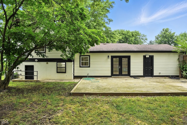 8041 Barry Rd, Indianapolis, IN 46219 - back of property with french doors, a deck, and a lawn