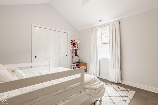35 E 58th St, Indianapolis, IN 46220 - bedroom featuring vaulted ceiling, wood finished floors, and a closet