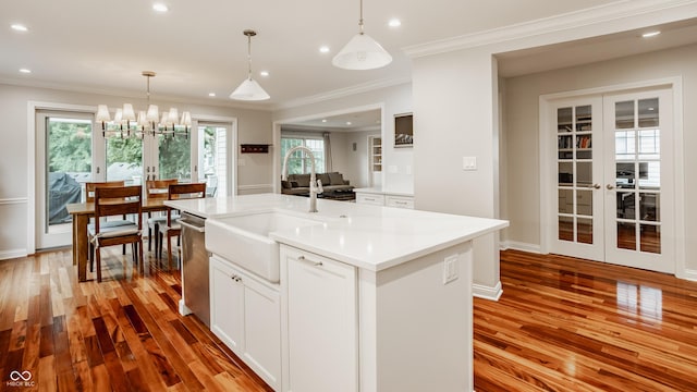 35 E 58th St, Indianapolis, IN 46220 - kitchen with french doors, light wood-style flooring, a chandelier, white cabinetry, and recessed lighting